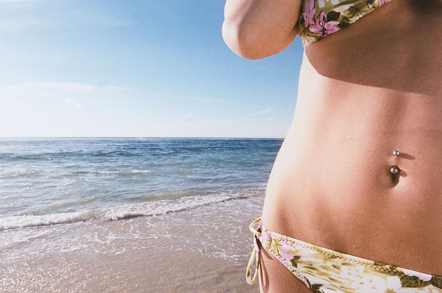 When is it safe to swim after a belly button piercing